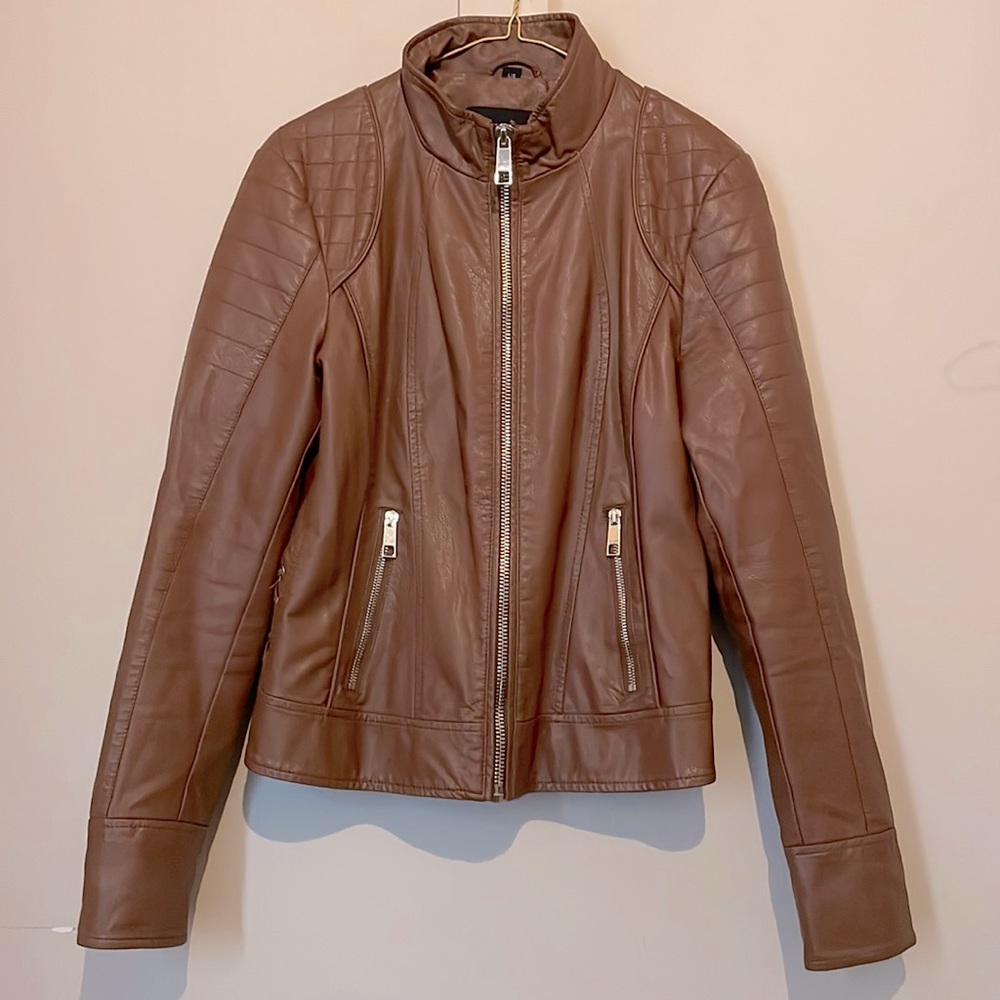 Large Brown leather jacket with silver zippers down the middle & both pockets.